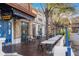 Charming street view with outdoor dining, a fountain, and lush greenery, creating an inviting atmosphere at 11109 Great Neck Rd, Riverview, FL 33578