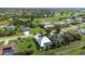 Stunning aerial view of a residential neighborhood featuring a golf course in the background at 1161 Rio De Janeiro Ave, Punta Gorda, FL 33983