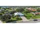 Wide aerial shot featuring a neighborhood of well-kept homes with verdant lawns and landscaping at 1161 Rio De Janeiro Ave, Punta Gorda, FL 33983