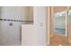 Shower stall with decorative tile trim and hand shower at 1161 Rio De Janeiro Ave, Punta Gorda, FL 33983