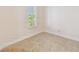 This bright bedroom features tile flooring and a window with shutters at 1161 Rio De Janeiro Ave, Punta Gorda, FL 33983
