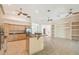 Bright kitchen with stainless appliances, granite countertops, a kitchen island, and ample cabinet space at 1161 Rio De Janeiro Ave, Punta Gorda, FL 33983