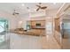 Bright kitchen with island, stainless appliances, granite counters, and light wood cabinetry at 1161 Rio De Janeiro Ave, Punta Gorda, FL 33983