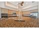 Bright kitchen with stainless steel appliances, granite countertops, and light wood cabinetry at 1161 Rio De Janeiro Ave, Punta Gorda, FL 33983