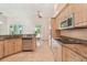 Open kitchen with granite countertops, stainless steel appliances, and access to the outdoors at 1161 Rio De Janeiro Ave, Punta Gorda, FL 33983