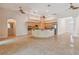 Spacious kitchen features tile floors, ceiling fans, light wood cabinets, and a large island at 1161 Rio De Janeiro Ave, Punta Gorda, FL 33983