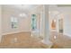 Spacious living room with tile floors, decorative columns, and a view of the front porch at 1161 Rio De Janeiro Ave, Punta Gorda, FL 33983