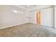 Spacious main bedroom featuring plush carpet, tray ceiling, and access to en-suite at 1161 Rio De Janeiro Ave, Punta Gorda, FL 33983