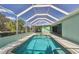 A screened-in pool offers a refreshing retreat with ample space for relaxation and recreation at 1161 Rio De Janeiro Ave, Punta Gorda, FL 33983