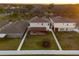 Aerial view of a fenced backyard with a trampoline and covered patio at 13110 Shumard Way, Riverview, FL 33579