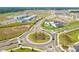 Aerial view of a new development with a school and neighborhood homes at 13110 Shumard Way, Riverview, FL 33579