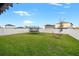 Spacious backyard featuring a trampoline, hammock, and white vinyl fencing at 13110 Shumard Way, Riverview, FL 33579