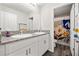 Charming bathroom with dual sinks, granite countertops, and a colorful shower curtain at 13110 Shumard Way, Riverview, FL 33579