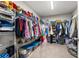 Spacious walk-in closet with ample shelving and organizational space for clothing at 13110 Shumard Way, Riverview, FL 33579
