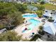 Aerial view of community pool with multiple pools and a playground at 13110 Shumard Way, Riverview, FL 33579