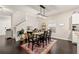 Inviting dining room with stylish light fixture, a decorative rug, and lots of natural light at 13110 Shumard Way, Riverview, FL 33579