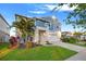 Charming two-story home featuring a well-manicured lawn and attached two-car garage at 13110 Shumard Way, Riverview, FL 33579