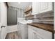 Well-organized laundry room with a folding counter, shelving, and a modern washer/dryer at 13110 Shumard Way, Riverview, FL 33579