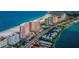 Aerial view of beachfront condos with beautiful white sand beach and turquoise ocean water at 1350 Gulf Blvd # 502, Clearwater Beach, FL 33767