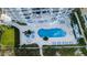 Aerial view of luxury condo building with a pool, spa, and beautifully landscaped grounds near the beach at 1350 Gulf Blvd # 502, Clearwater Beach, FL 33767