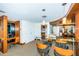A room with a modern design featuring a glass table, wood accents, and office equipment at 1350 Gulf Blvd # 502, Clearwater Beach, FL 33767