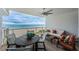 Balcony with seating area overlooking the beach and ocean, perfect for relaxation at 1350 Gulf Blvd # 502, Clearwater Beach, FL 33767