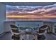 Relaxing balcony with seating area to enjoy serene ocean views and colorful sunsets at 1350 Gulf Blvd # 502, Clearwater Beach, FL 33767
