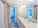 Bathroom features dual sinks, a mirror, and easy access to the bedrooms at 1350 Gulf Blvd # 502, Clearwater Beach, FL 33767