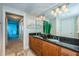 Bathroom with double sink vanity, granite countertops, and modern lighting at 1350 Gulf Blvd # 502, Clearwater Beach, FL 33767