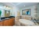 Beautiful bathroom featuring vanity with tub; luxurious soaking tub at 1350 Gulf Blvd # 502, Clearwater Beach, FL 33767