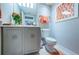 Updated half bathroom with modern vanity, lighting, and decor at 1350 Gulf Blvd # 502, Clearwater Beach, FL 33767