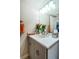 Updated half bathroom with modern vanity, lighting, and decor at 1350 Gulf Blvd # 502, Clearwater Beach, FL 33767