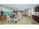The dining area with chandelier is located between the living room and kitchen at 1350 Gulf Blvd # 502, Clearwater Beach, FL 33767