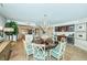 Dining room features a chandelier, kitchen access, and bar at 1350 Gulf Blvd # 502, Clearwater Beach, FL 33767