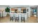Kitchen with island and seating, wood cabinetry, and modern appliances at 1350 Gulf Blvd # 502, Clearwater Beach, FL 33767
