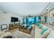 Living room area with ocean views and sliding glass doors to a beautiful balcony at 1350 Gulf Blvd # 502, Clearwater Beach, FL 33767