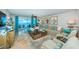 Inviting living room with stunning ocean views, comfortable seating, and stylish decor at 1350 Gulf Blvd # 502, Clearwater Beach, FL 33767