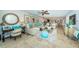 Bright, airy living room with comfortable seating, neutral tones, and travertine floors at 1350 Gulf Blvd # 502, Clearwater Beach, FL 33767
