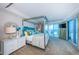 Luxurious main bedroom featuring modern furnishings, ocean views, and a private balcony at 1350 Gulf Blvd # 502, Clearwater Beach, FL 33767