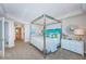Bright main bedroom with beach decor, neutral carpet, and ensuite bathroom at 1350 Gulf Blvd # 502, Clearwater Beach, FL 33767