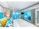 Spacious main bedroom with ocean views from the bed and access to a private balcony at 1350 Gulf Blvd # 502, Clearwater Beach, FL 33767