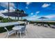 Outdoor patio with dining area and beach views at 1350 Gulf Blvd # 502, Clearwater Beach, FL 33767