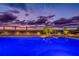 Beautiful pool at sunset, with lounge chairs, umbrellas, palm trees, and a serene beachfront view at 1350 Gulf Blvd # 502, Clearwater Beach, FL 33767