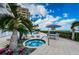 Relaxing patio area featuring a spa and tropical landscaping at 1350 Gulf Blvd # 502, Clearwater Beach, FL 33767