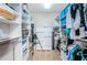 Organized walk-in closet with custom shelving and ample storage space for clothes and accessories at 1350 Gulf Blvd # 502, Clearwater Beach, FL 33767