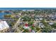Aerial view of the property with a swimming pool, surrounded by other homes and the intercoastal waterway at 1508 Eden Isle Ne Blvd, St Petersburg, FL 33704