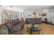 Open living area featuring hardwood floors, with dining and pool views for seamless entertaining at 1508 Eden Isle Ne Blvd, St Petersburg, FL 33704