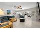 Spacious living room adjacent to a kitchen and workout area, great for modern living at 1508 Eden Isle Ne Blvd, St Petersburg, FL 33704