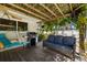 Outdoor patio with pergola, complete with seating and grill for entertaining at 1508 Eden Isle Ne Blvd, St Petersburg, FL 33704