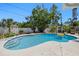 Relaxing backyard pool with sun-drenched deck, perfect for outdoor enjoyment and entertaining guests at 1508 Eden Isle Ne Blvd, St Petersburg, FL 33704